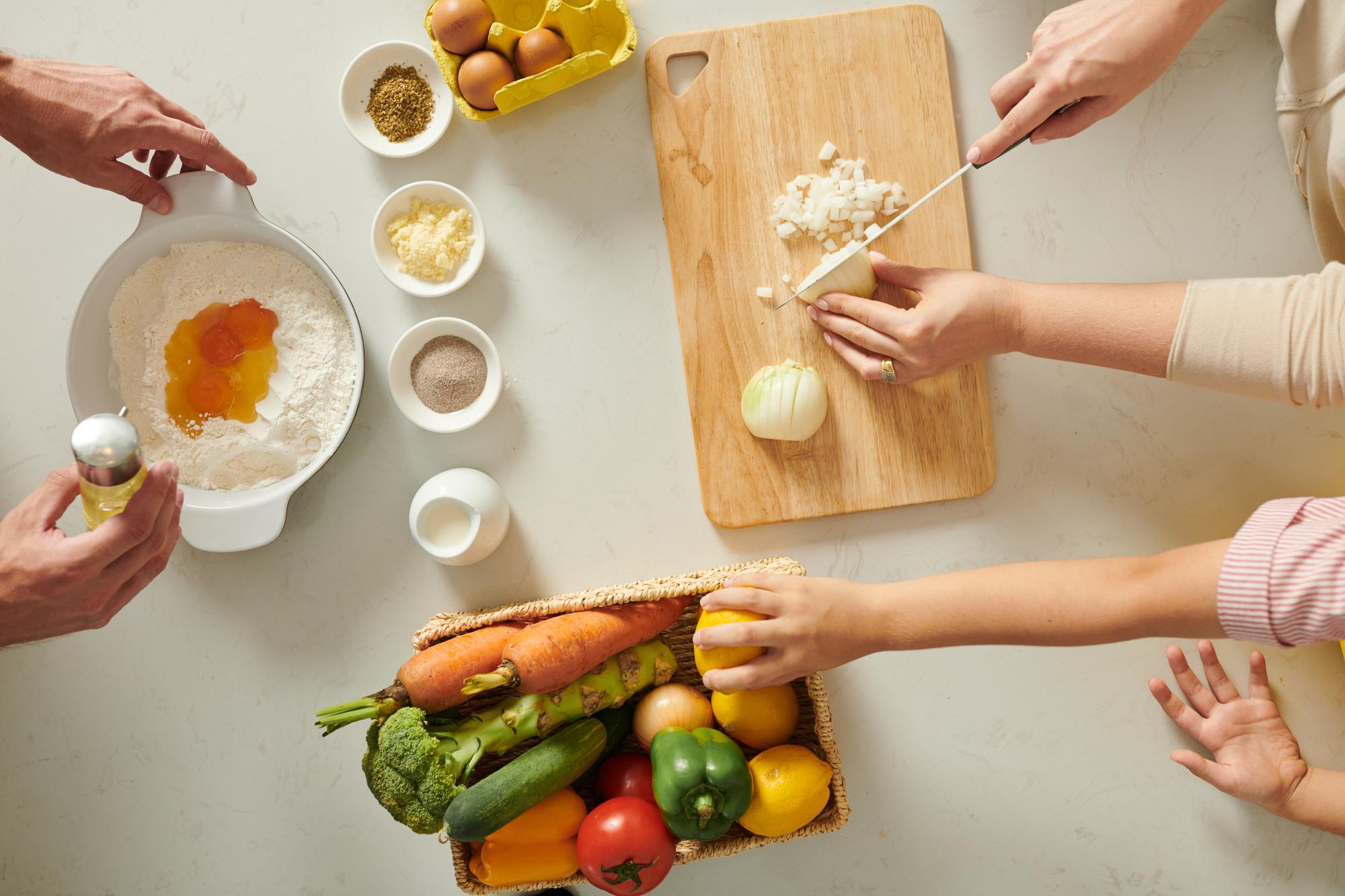 Hands preparing ingredients in workshop